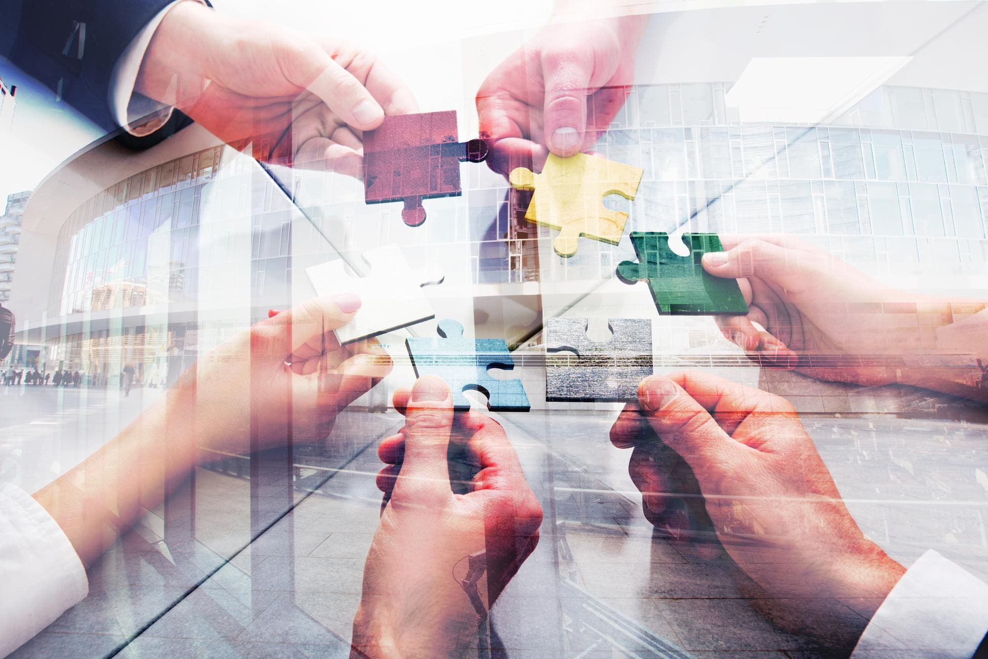 teamwork-partners-concept-integration-startup-with-puzzle-pieces-double-exposure